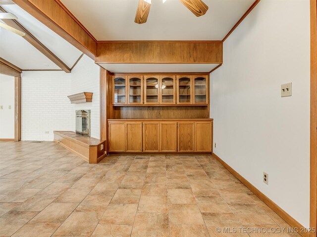 7446 E 20th St, Tulsa, OK 74112 - bar with ceiling fan, a brick fireplace, and light stone finish floors