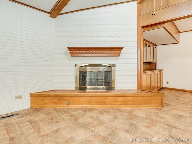 7446 E 20th St, Tulsa, OK 74112 - unfurnished living room featuring stone finish floors, a fireplace, and baseboards