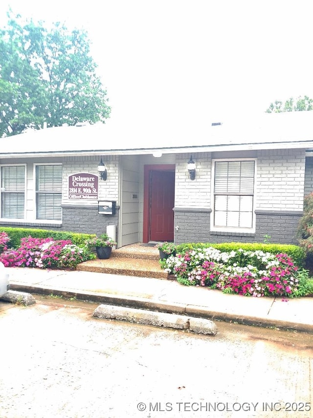 9023 S Delaware Ave Unit 605, Tulsa, OK 74137 - view of front of house featuring brick siding