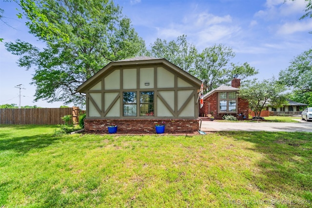 9599 E 155th Ave N, Owasso, OK 74055 - english style home featuring a chimney, brick siding, and stucco siding