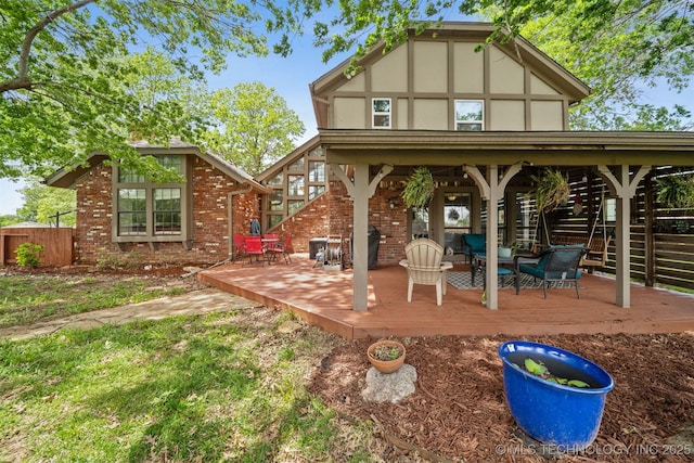 9599 E 155th Ave N, Owasso, OK 74055 - back of property featuring a deck, brick siding, and an outdoor living space