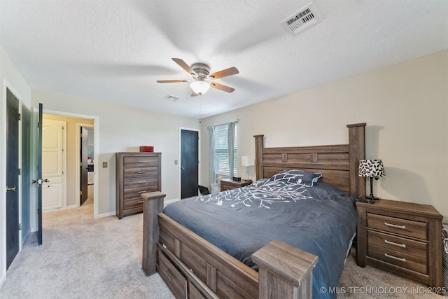 9599 E 155th Ave N, Owasso, OK 74055 - bedroom with light carpet, a ceiling fan, and a textured ceiling