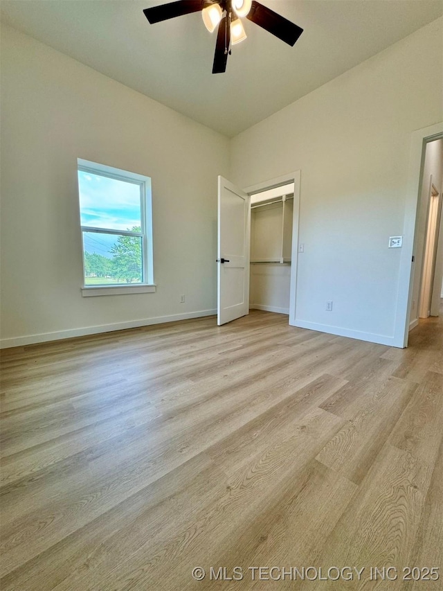 430254 E 1146th Rd, Porum, OK 74455 - unfurnished bedroom with light wood finished floors, baseboards, and ceiling fan