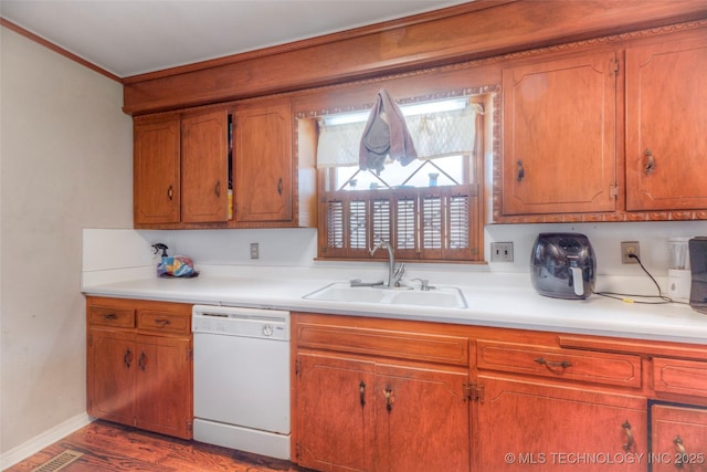 5102 S Columbia Ave, Tulsa, OK 74105 - kitchen with white dishwasher, a sink, light countertops, brown cabinets, and ornamental molding