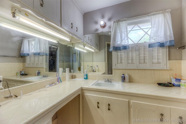 5102 S Columbia Ave, Tulsa, OK 74105 - bathroom with backsplash and vanity
