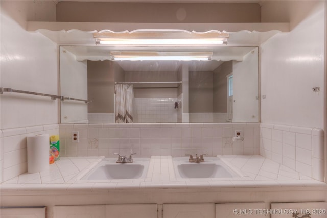 5102 S Columbia Ave, Tulsa, OK 74105 - bathroom with decorative backsplash, double vanity, and a shower with shower curtain