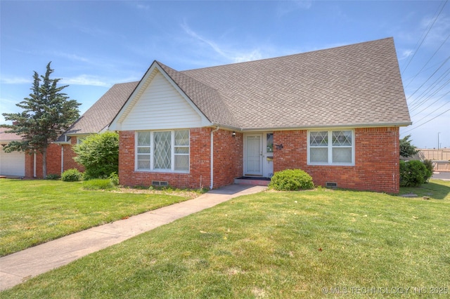 5102 S Columbia Ave, Tulsa, OK 74105 - view of front of home featuring brick siding, a front yard, crawl space, and a shingled roof