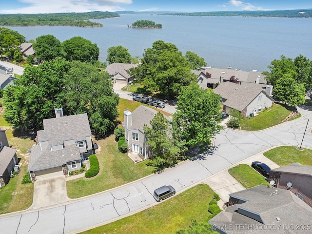 aerial view of residential area with a nearby body of water