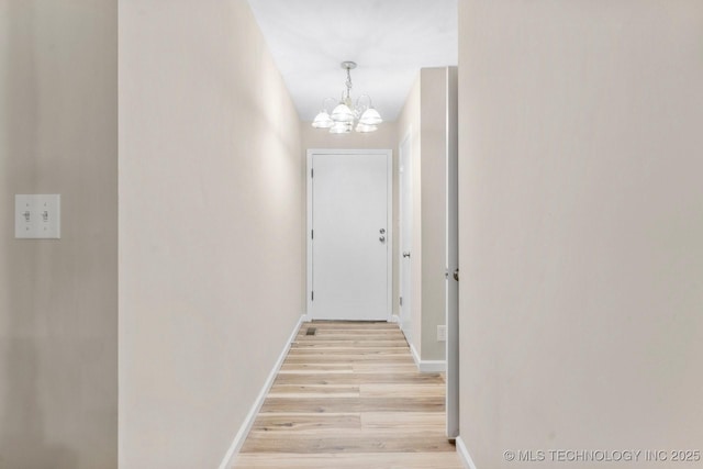 11815 S 86th E Ave, Bixby, OK 74008 - hallway with a chandelier, light wood-style flooring, and baseboards