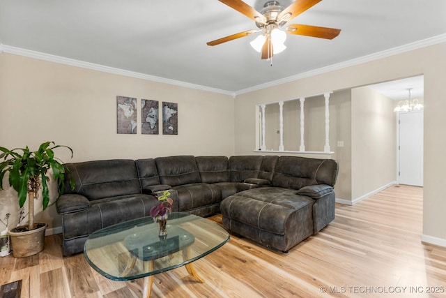 11815 S 86th E Ave, Bixby, OK 74008 - living room with light wood-type flooring, crown molding, baseboards, a ceiling fan, and a chandelier