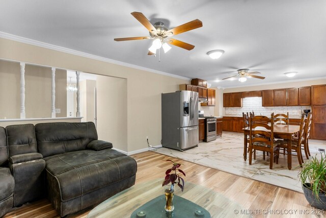 11815 S 86th E Ave, Bixby, OK 74008 - living room featuring a ceiling fan, crown molding, and baseboards