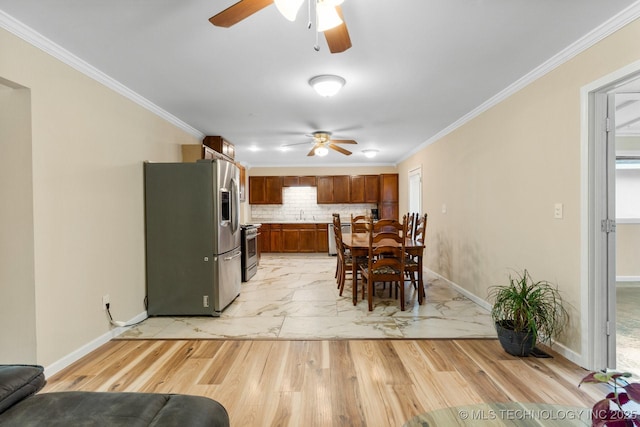 11815 S 86th E Ave, Bixby, OK 74008 - dining room featuring ceiling fan, ornamental molding, baseboards, and light wood-type flooring