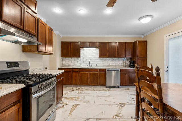 11815 S 86th E Ave, Bixby, OK 74008 - kitchen featuring stainless steel appliances, under cabinet range hood, a sink, ornamental molding, and light countertops