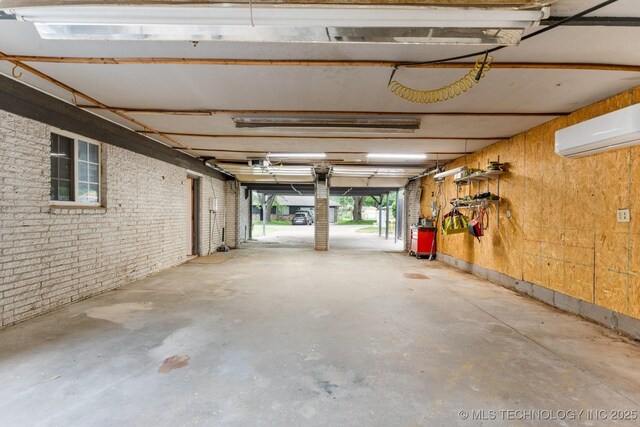 11815 S 86th E Ave, Bixby, OK 74008 - garage with a wall mounted AC and a garage door opener
