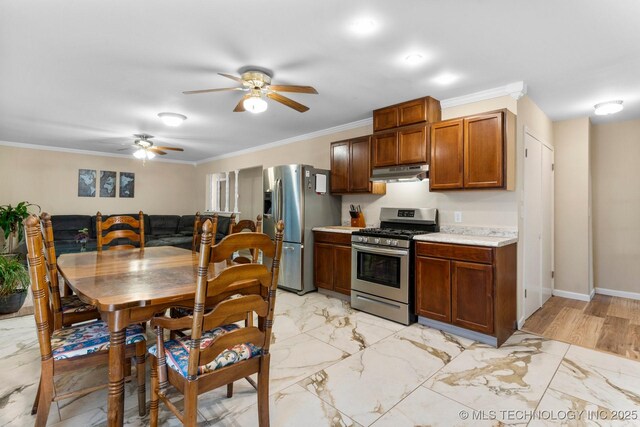 11815 S 86th E Ave, Bixby, OK 74008 - kitchen with appliances with stainless steel finishes, under cabinet range hood, a ceiling fan, light countertops, and light marble finish floors