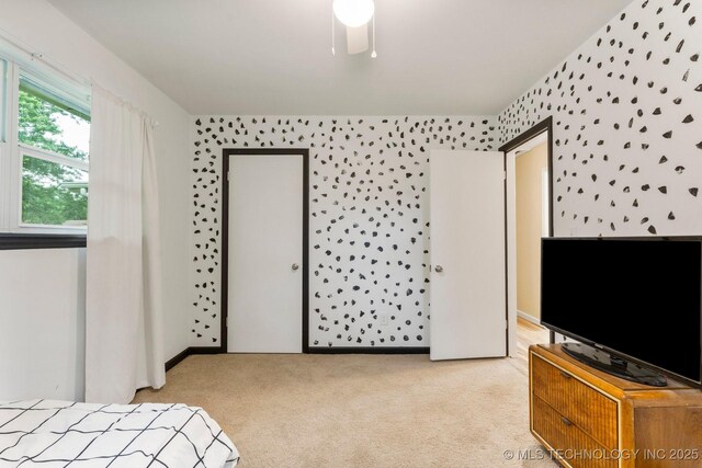 11815 S 86th E Ave, Bixby, OK 74008 - unfurnished bedroom featuring light carpet and ceiling fan