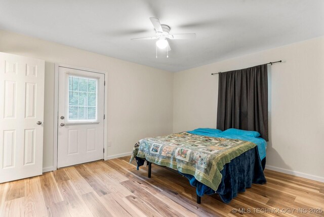 11815 S 86th E Ave, Bixby, OK 74008 - bedroom with light wood-style flooring, baseboards, and ceiling fan