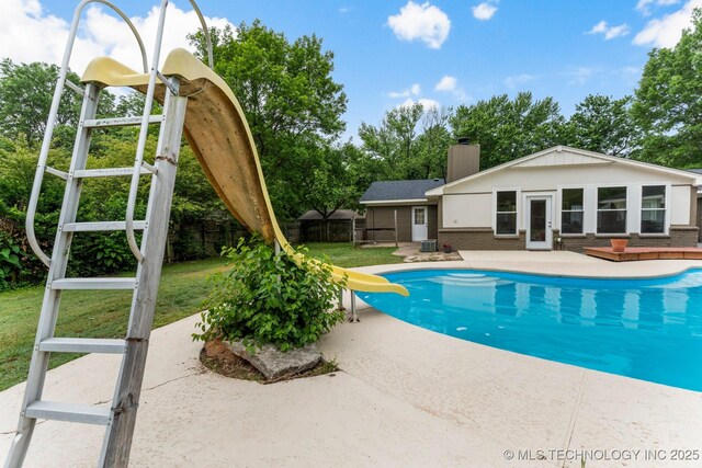 11815 S 86th E Ave, Bixby, OK 74008 - view of swimming pool with a water slide, a patio area, and a fenced backyard