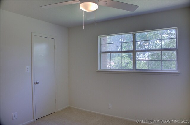 4601 S 66th Ave E, Tulsa, OK 74145 - carpeted empty room with healthy amount of natural light, a ceiling fan, and baseboards