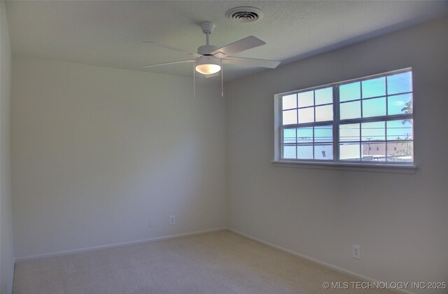 4601 S 66th Ave E, Tulsa, OK 74145 - spare room with light carpet, a ceiling fan, and baseboards