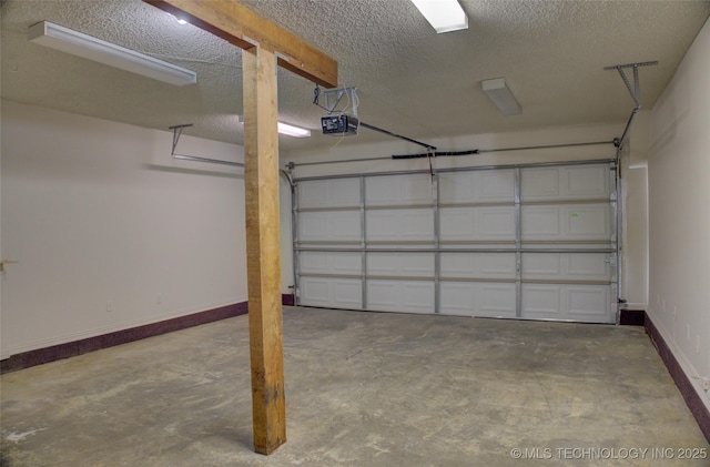 4601 S 66th Ave E, Tulsa, OK 74145 - garage with a garage door opener and baseboards