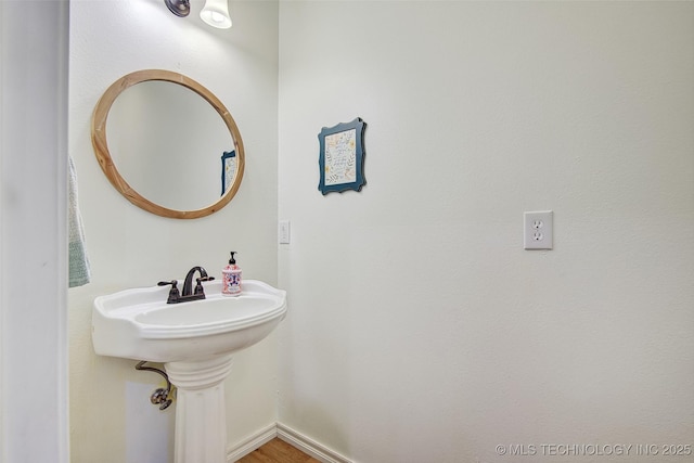 21304 S 4200th Rd, Claremore, OK 74019 - bathroom featuring wood finished floors and baseboards