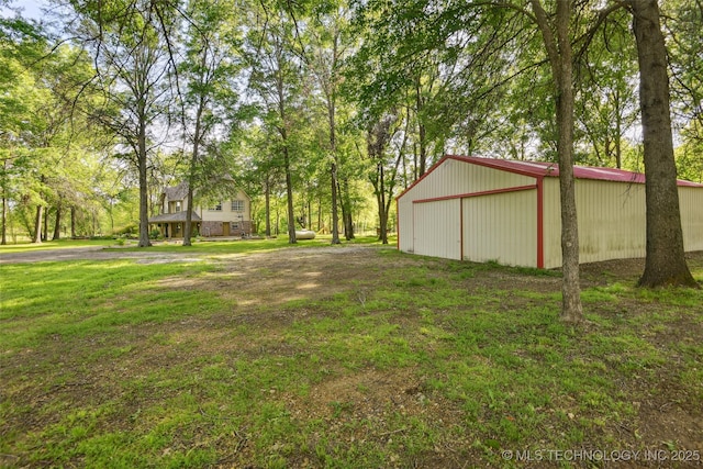 21304 S 4200th Rd, Claremore, OK 74019 - view of green lawn with an outbuilding, an outdoor structure, and a detached garage