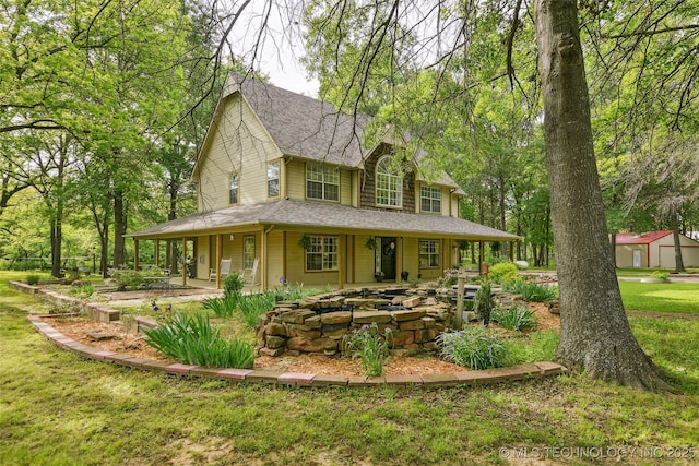 21304 S 4200th Rd, Claremore, OK 74019 - farmhouse-style home featuring a front lawn and roof with shingles
