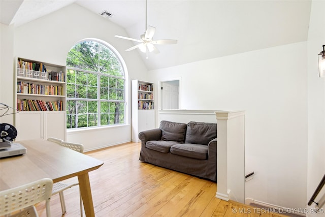 21304 S 4200th Rd, Claremore, OK 74019 - living room with ceiling fan, light wood-style flooring, plenty of natural light, high vaulted ceiling, and baseboards