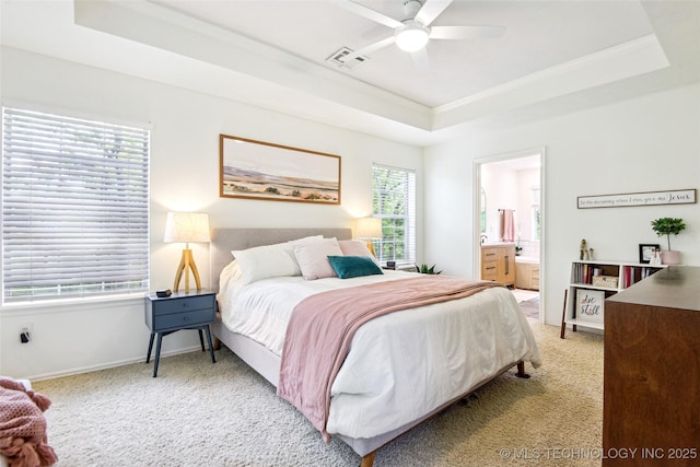 21304 S 4200th Rd, Claremore, OK 74019 - bedroom featuring a raised ceiling, light carpet, ensuite bathroom, baseboards, and ceiling fan