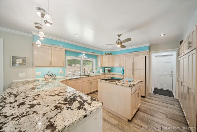 5094 N 209th W Ave, Sand Springs, OK 74063 - kitchen featuring a sink, light brown cabinets, light stone counters, light wood-style floors, and black electric stovetop