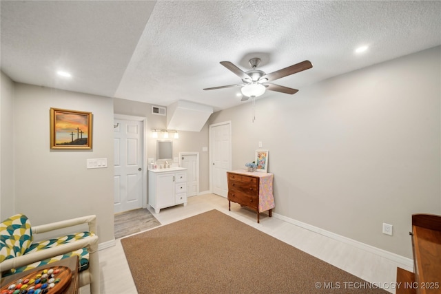 5094 N 209th W Ave, Sand Springs, OK 74063 - bedroom featuring recessed lighting, baseboards, a textured ceiling, a ceiling fan, and ensuite bath