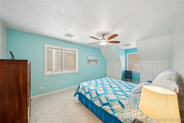 5094 N 209th W Ave, Sand Springs, OK 74063 - bedroom with carpet floors, ceiling fan, baseboards, vaulted ceiling, and a textured ceiling