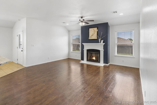 2805 W Fredericksburg St, Broken Arrow, OK 74011 - unfurnished living room with a ceiling fan, a glass covered fireplace, wood finished floors, recessed lighting, and baseboards