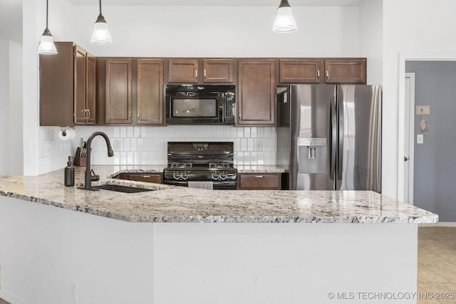 2805 W Fredericksburg St, Broken Arrow, OK 74011 - kitchen with black appliances, a sink, backsplash, and light stone counters
