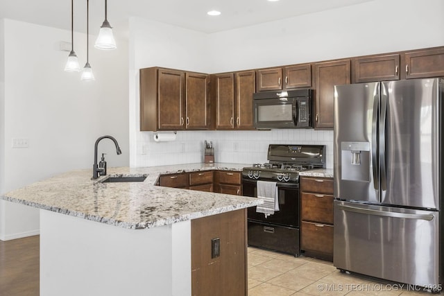 2805 W Fredericksburg St, Broken Arrow, OK 74011 - kitchen with black appliances, a sink, a peninsula, and decorative backsplash