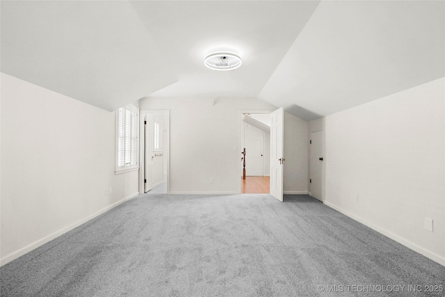 1208 E 29th St, Tulsa, OK 74114 - additional living space with carpet, lofted ceiling, and baseboards