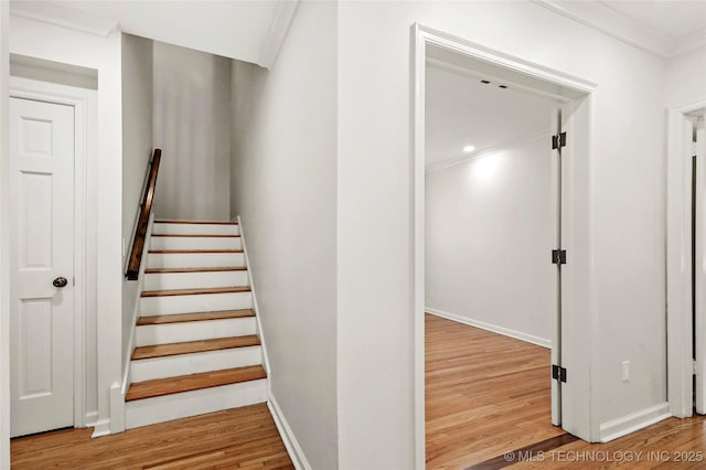 1208 E 29th St, Tulsa, OK 74114 - stairway with wood finished floors, ornamental molding, and baseboards
