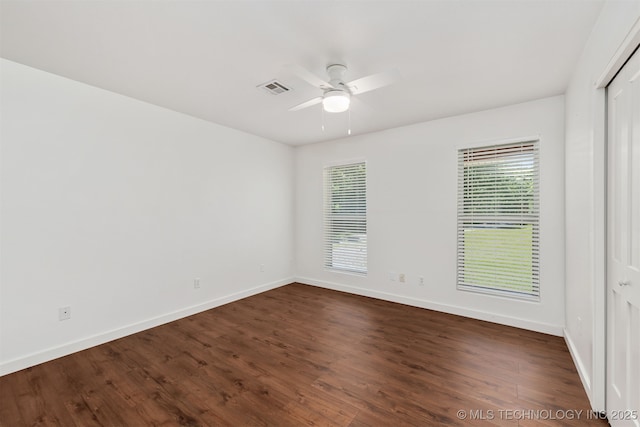 6345 W 53rd St, Tulsa, OK 74126 - empty room with baseboards, dark wood-style flooring, and a ceiling fan