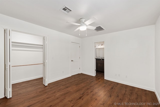 6345 W 53rd St, Tulsa, OK 74126 - unfurnished bedroom featuring dark wood-style floors, baseboards, connected bathroom, and a ceiling fan