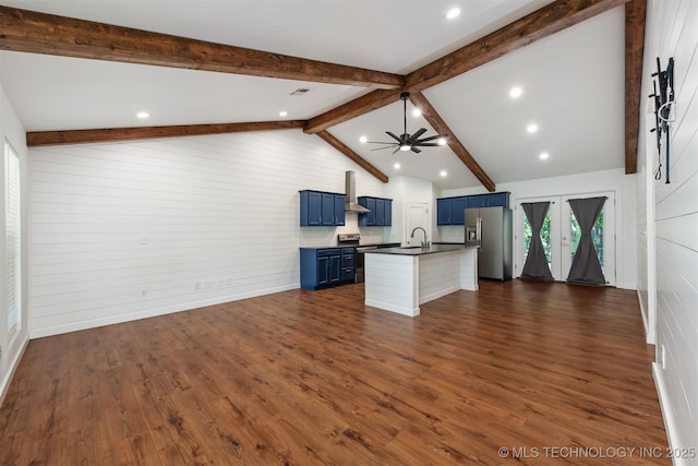 6345 W 53rd St, Tulsa, OK 74126 - kitchen featuring blue cabinets, stainless steel fridge, wall chimney range hood, a sink, and dark countertops