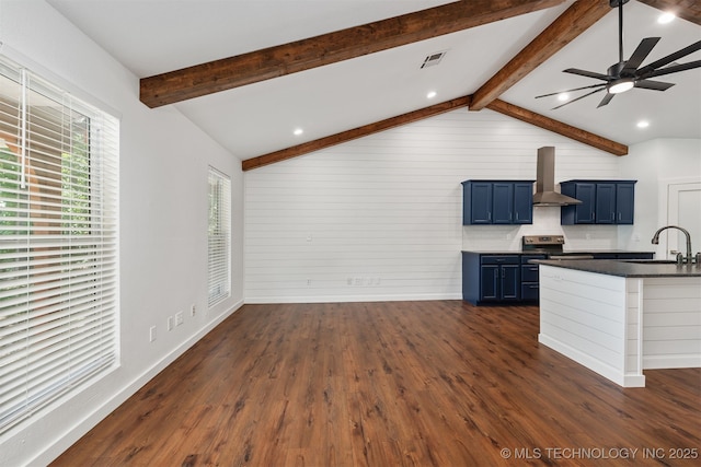 6345 W 53rd St, Tulsa, OK 74126 - kitchen with blue cabinets, wall chimney exhaust hood, dark wood-style flooring, a sink, and dark countertops