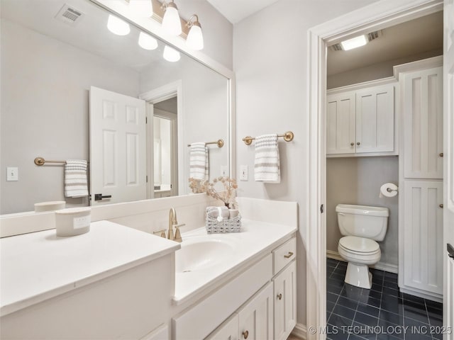 506 E 120th Pl S, Jenks, OK 74037 - bathroom with toilet, vanity, and tile patterned flooring