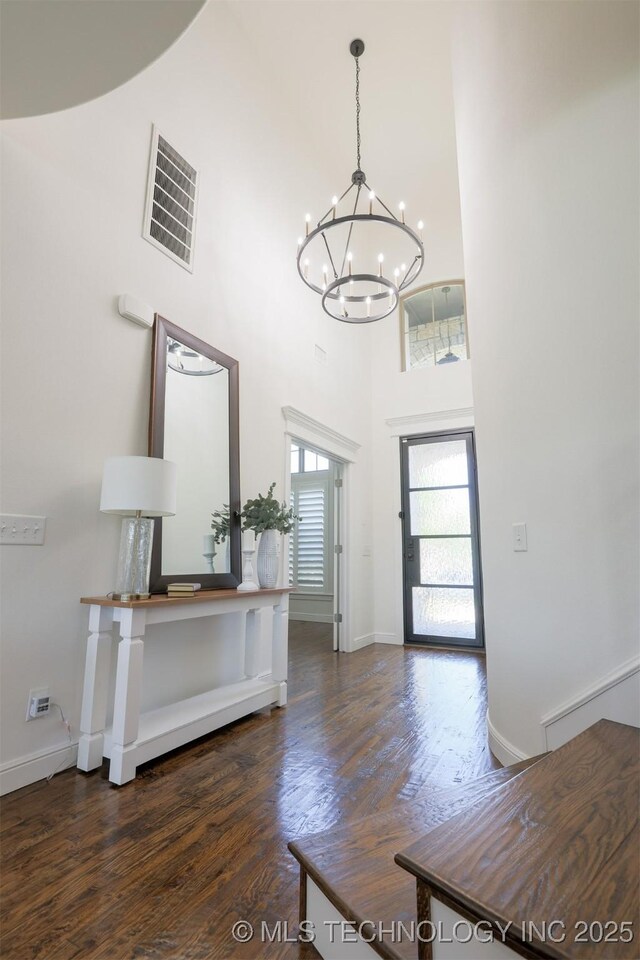 16958 E 45th St, Tulsa, OK 74134 - foyer entrance featuring a towering ceiling, a chandelier, and dark wood-style flooring