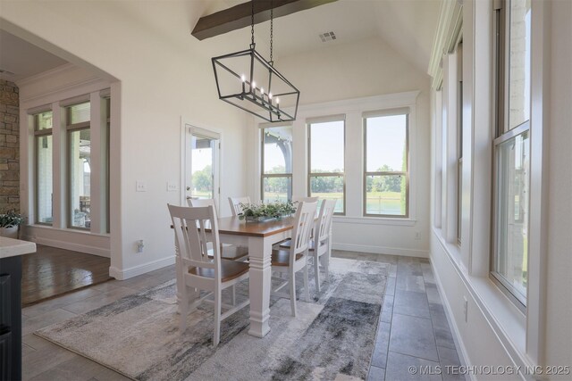 16958 E 45th St, Tulsa, OK 74134 - dining room featuring plenty of natural light, a chandelier, tile patterned flooring, and vaulted ceiling