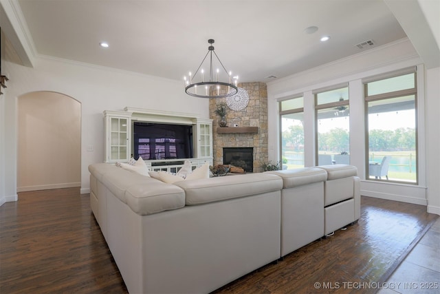 16958 E 45th St, Tulsa, OK 74134 - living area featuring a chandelier, ornamental molding, dark wood-style floors, a fireplace, and recessed lighting