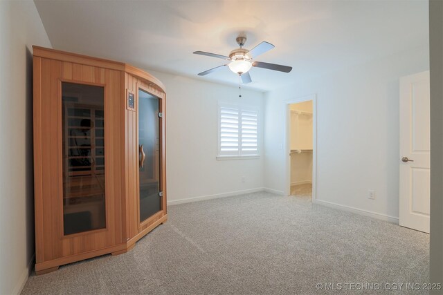 16958 E 45th St, Tulsa, OK 74134 - unfurnished bedroom with a spacious closet, light carpet, a closet, and a ceiling fan