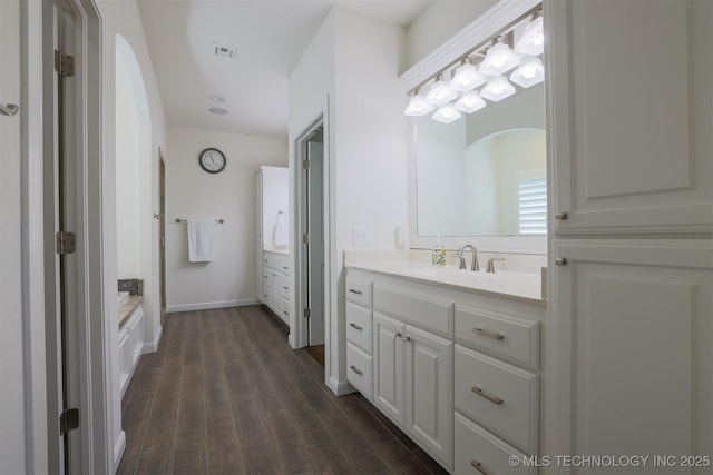 16958 E 45th St, Tulsa, OK 74134 - full bath featuring vanity, wood finished floors, and a bath