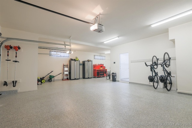 16958 E 45th St, Tulsa, OK 74134 - garage with a garage door opener and freestanding refrigerator