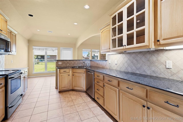 2000 W Vail St, Broken Arrow, OK 74012 - kitchen with stainless steel appliances, dark countertops, tasteful backsplash, light brown cabinets, and light tile patterned flooring
